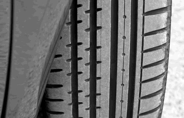 What to know when purchasing tires - tire tread on asphalt